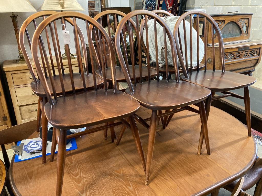 A set of six Ercol elm and beech Windsor dining chairs